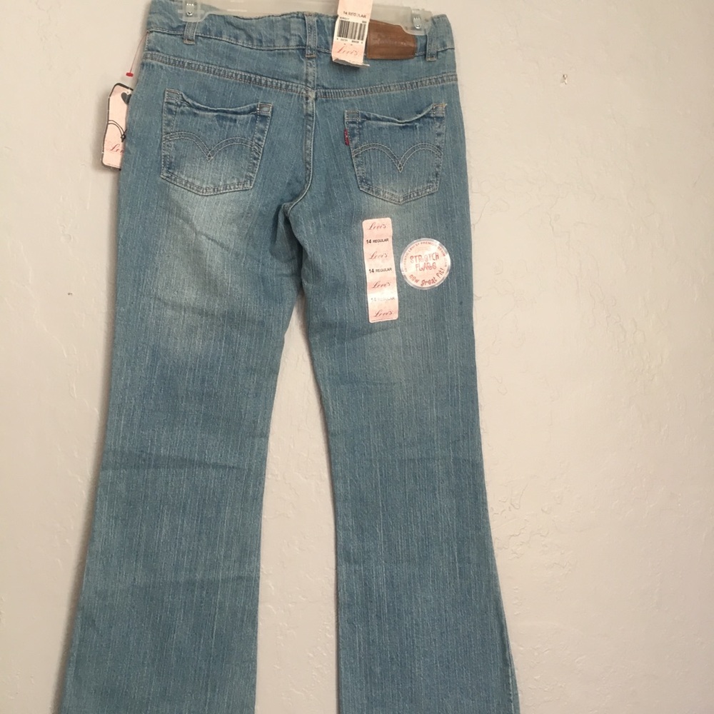 Levi’s!! Size 14 kids would fit a small adult
